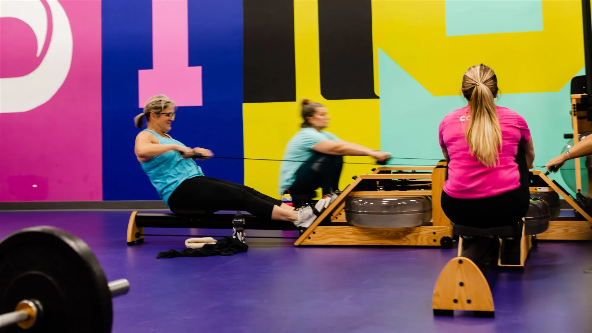 Members working through a coach-led small group strength training session at Studio ME Fitness in Northeast Minneapolis.